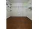 Walk-in closet with white shelving and hardwood floors at 2913 Jordan Forest Trl, Lawrenceville, GA 30044