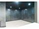 Finished basement area with dark accent wall and sleek herringbone flooring at 3258 Bransley Way, Duluth, GA 30097