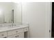 Bright bathroom featuring a marble countertop vanity and a large mirror at 3258 Bransley Way, Duluth, GA 30097