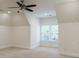 Dormered bedroom with plush carpeting, neutral walls, and abundant natural light at 3258 Bransley Way, Duluth, GA 30097
