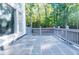 Back patio featuring gray slate tile flooring, a railing, and a view of the backyard at 3258 Bransley Way, Duluth, GA 30097
