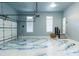 Well-lit garage features epoxy flooring, high ceilings, and plenty of room at 3258 Bransley Way, Duluth, GA 30097