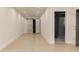 Hallway with wood floors, sliding barn door and access to the ensuite bathroom with glass shower at 3258 Bransley Way, Duluth, GA 30097