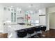 Stylish kitchen island with marble countertops, modern pendant lights, and white cabinetry at 3258 Bransley Way, Duluth, GA 30097