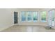 Bright room featuring windows, an exterior door, and Herringbone flooring at 3258 Bransley Way, Duluth, GA 30097