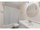 Bathroom features a shower-tub combo and ample vanity space at 334 Bridgewood Se Dr, Conyers, GA 30094