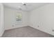 Neutral bedroom featuring carpet, a window, and ample space at 334 Bridgewood Se Dr, Conyers, GA 30094