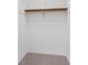 A walk-in closet with a high mounted shelf at 334 Bridgewood Se Dr, Conyers, GA 30094