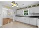 Classic kitchen with tile floor, floral accents, and view to a dining room at 334 Bridgewood Se Dr, Conyers, GA 30094