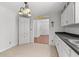 Bright kitchen nook with cabinetry, tile floor, and view to front entryway at 334 Bridgewood Se Dr, Conyers, GA 30094