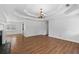 Bright and airy living room with wood floors, tray ceiling, and ample natural light at 334 Bridgewood Se Dr, Conyers, GA 30094