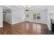 Hardwood floors and natural light create an inviting space with an exterior door and fireplace at 334 Bridgewood Se Dr, Conyers, GA 30094