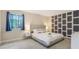 Comfortable bedroom with a plush bed, stylish accent wall, and soft neutral tones at 4064 Chimney Ridge Way, Ellenwood, GA 30294