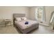 Bright, airy bedroom with a comfortable bed, bedside table, and a full-length mirror at 4064 Chimney Ridge Way, Ellenwood, GA 30294