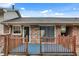 The back deck features a wooden railing and entry to home through glass sliding door at 5440 Huron Dr, Lake City, GA 30260