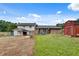 A view of the home's backyard, back deck, and red storage shed at 5440 Huron Dr, Lake City, GA 30260
