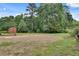 View of the home's backyard with a small storage shed at 5440 Huron Dr, Lake City, GA 30260