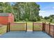 Inviting backyard featuring a deck, a storage shed, and a fenced yard at 5440 Huron Dr, Lake City, GA 30260