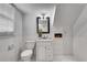 Bathroom featuring hexagon tiled floors, tiled walls, neutral colors, and a vanity at 5440 Huron Dr, Lake City, GA 30260