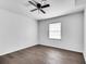 Bedroom with hardwood floors, a ceiling fan, and a window with natural light at 5440 Huron Dr, Lake City, GA 30260