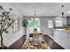 Charming dining room features hardwood floors and large windows at 5440 Huron Dr, Lake City, GA 30260