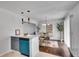 View of dining room and kitchen with stainless steel appliances and bright lighting at 5440 Huron Dr, Lake City, GA 30260