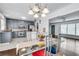 Open concept kitchen and dining room with modern lighting at 5440 Huron Dr, Lake City, GA 30260