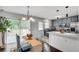 Open floor plan with kitchen, breakfast nook, and sliding glass doors to backyard at 5440 Huron Dr, Lake City, GA 30260