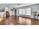 Bright living room with hardwood floors, staircase and large windows at 5440 Huron Dr, Lake City, GA 30260