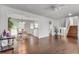An open-concept living room with hardwood floors and a staircase at 5440 Huron Dr, Lake City, GA 30260