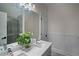 Well-lit bathroom with a dual-sink vanity and a tiled glass shower at 8630 Moor Park Run, Duluth, GA 30097