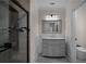 Modern bathroom with tiled shower, sleek vanity, and elegant finishes creating a spa-like experience at 8630 Moor Park Run, Duluth, GA 30097