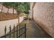Long driveway leading to the side of a brick home at 8630 Moor Park Run, Duluth, GA 30097