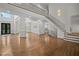 Elegant foyer with grand staircase, hardwood floors, and double front doors at 8630 Moor Park Run, Duluth, GA 30097