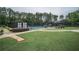 Community tennis courts surrounded by lush greenery, offering a scenic and active lifestyle at 8630 Moor Park Run, Duluth, GA 30097