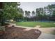 Well maintained tennis courts and sidewalk with lush landscaping providing a picturesque setting for an active lifestyle at 8630 Moor Park Run, Duluth, GA 30097