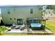 Backyard view featuring a jacuzzi, pergola, and outdoor seating area at 109 Red Fox Dr, Dallas, GA 30157