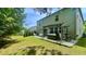 A relaxing backyard with a patio, hot tub, and lush green lawn. Perfect for entertaining at 109 Red Fox Dr, Dallas, GA 30157