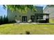 Well-maintained backyard with a patio, hot tub, and lush lawn, ideal for outdoor living at 109 Red Fox Dr, Dallas, GA 30157