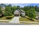 Charming two-story home with a stone-accented garage and manicured landscaping at 109 Red Fox Dr, Dallas, GA 30157