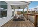 Relaxing outdoor back porch featuring comfortable seating and a ceiling fan to keep you cool at 3440 Hardy St, Duluth, GA 30096
