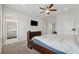 Bright bedroom featuring an ensuite bathroom, tv and neutral decor, creating a relaxing atmosphere at 3440 Hardy St, Duluth, GA 30096