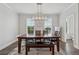 Bright dining room featuring modern chandelier and large windows at 3440 Hardy St, Duluth, GA 30096