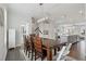 Bright dining room featuring modern chandelier and sight lines to kitchen at 3440 Hardy St, Duluth, GA 30096