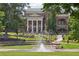Classic City Hall building with stately columns, a grand fountain, and lush green landscaping at 3440 Hardy St, Duluth, GA 30096
