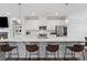 Beautiful kitchen featuring white cabinets, stainless steel appliances, and island with seating at 3440 Hardy St, Duluth, GA 30096