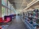 Bright and airy library interior featuring rows of bookshelves, comfortable seating, and large windows at 3440 Hardy St, Duluth, GA 30096