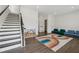 Inviting living room features staircase, recessed lights and rainbow rug at 3440 Hardy St, Duluth, GA 30096