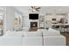 Bright open concept living room featuring fireplace and modern sectional at 3440 Hardy St, Duluth, GA 30096