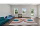 Inviting living room features recessed lights, large windows, and cozy rug at 3440 Hardy St, Duluth, GA 30096